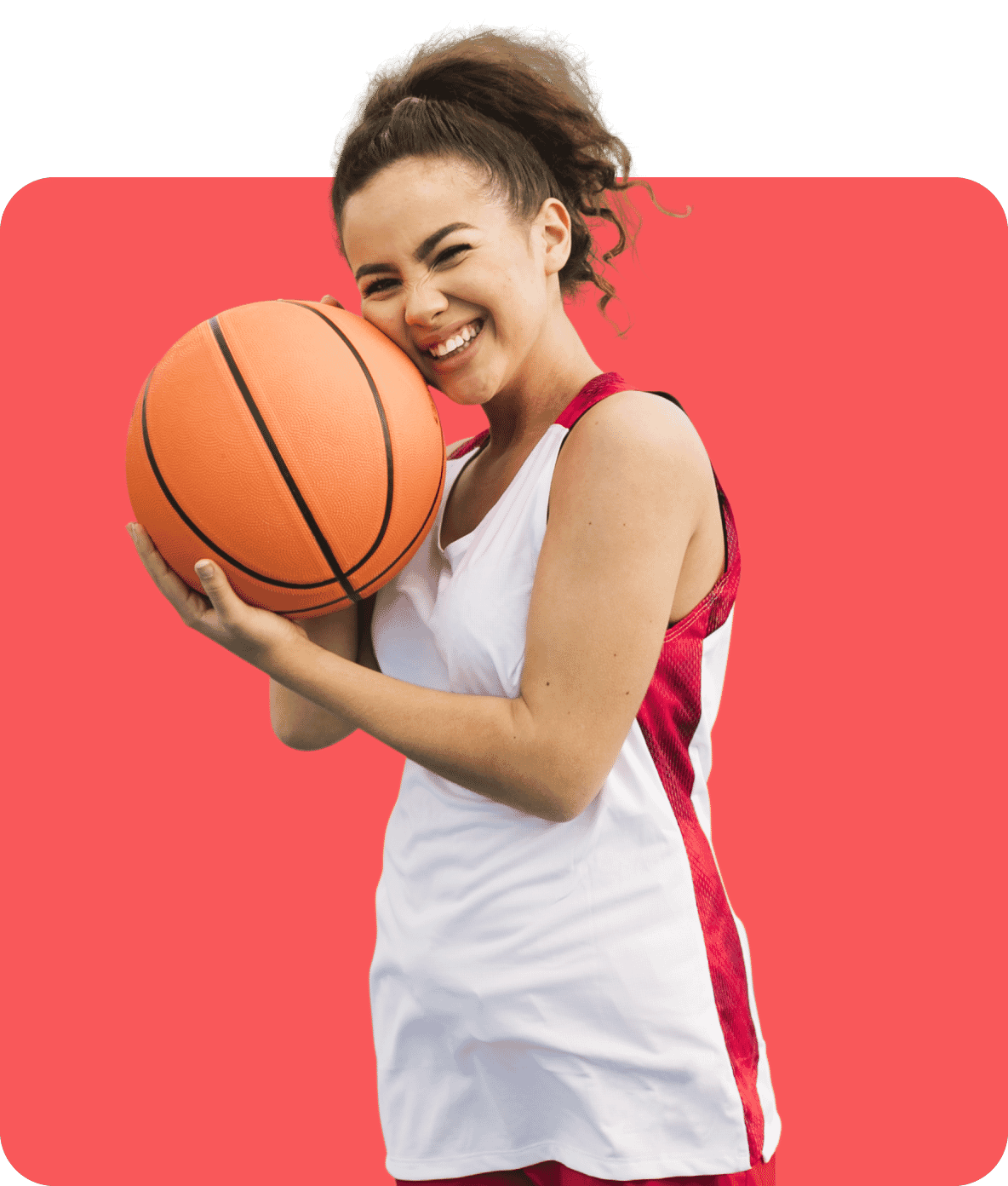 Smiling basketball player holding a ball, edited with a vivid red background and sharp details for enhanced sports imagery.