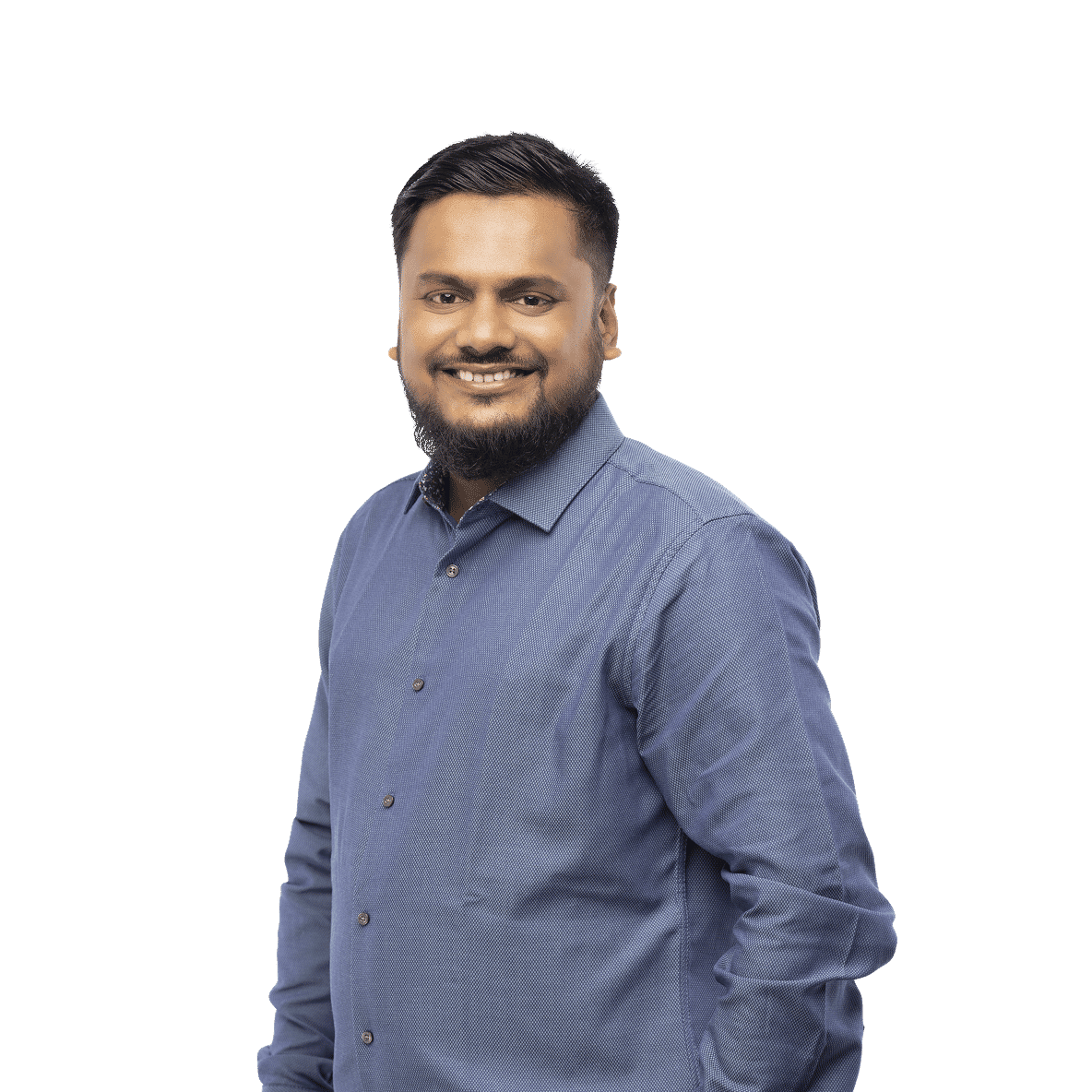 Smiling order and service manager in long-sleeve blue textured shirt with hands in pockets, edited