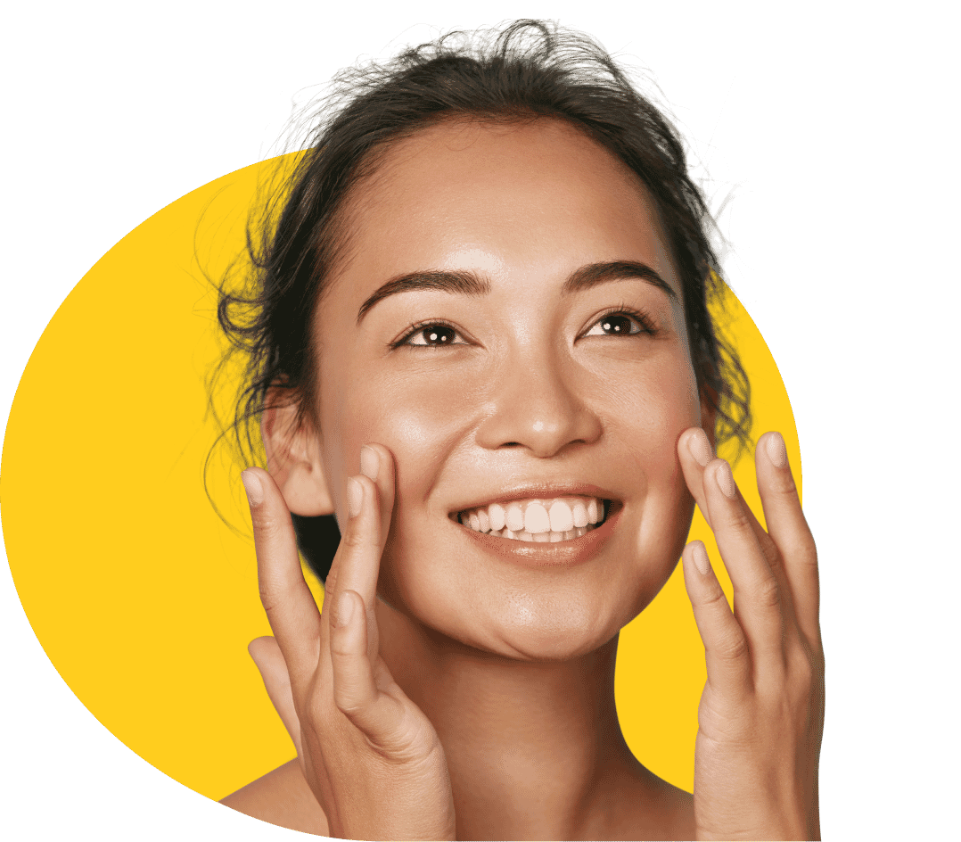 Smiling woman with a vibrant yellow background, showcasing Path’s pixel-perfect and professional photo retouching services.
